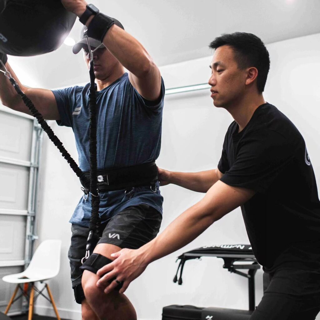 Dr. Isaac Auyeung performing movement assessment with client in Torrance physical therapy clinic