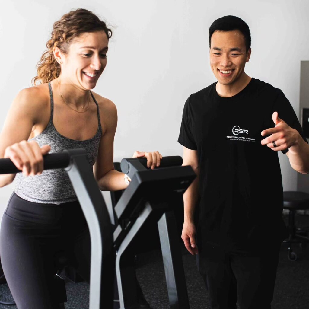 Board-certified physical therapist working with active adult in Torrance, CA sports rehab clinic